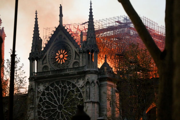 Flames and smoke billow from the roof at Notre-Dame Cathedral in Paris on April 15,