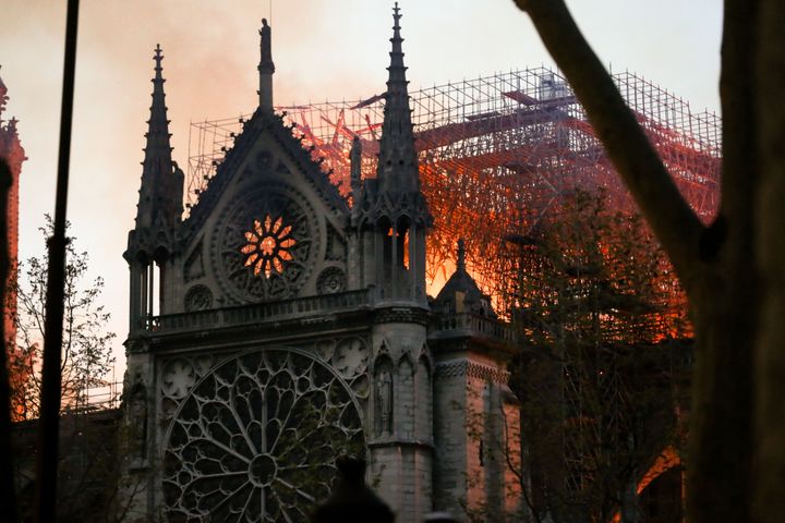 Flames and smoke billow from the roof at Notre-Dame Cathedral in Paris on April 15, 2019.