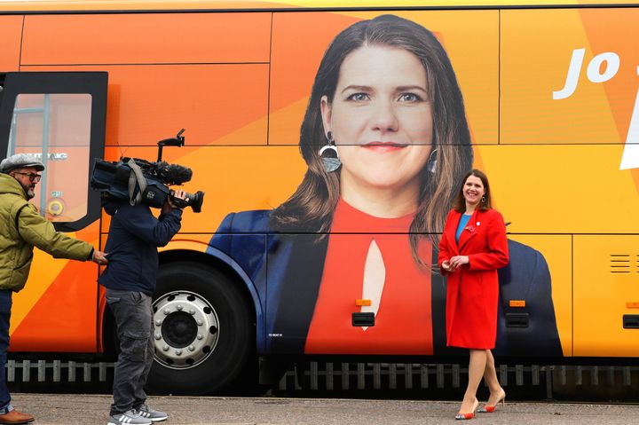 Liberal Democrat leader Jo Swinson in front of the party battle bus after a visit to Sigma Pharmaceuticals in North Watford, London.
