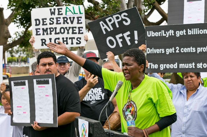 Uber driver Estaphanie St. Just joins drivers for ride-hailing giants Uber and Lyft as they hold a rally near Los Angeles International Airport on May 8. Some drivers turned off their apps to protest what they said were declining wages.