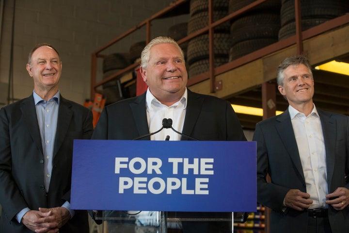 Ontario Premier Doug Ford (centre) with Minister of Finance Rod Phillips (right) at a Toronto announcement Sept. 28, 2019.