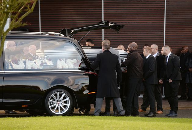 The coffin of Dalian Atkinson is carried into Telford Crematorium Chapel for his funeral 