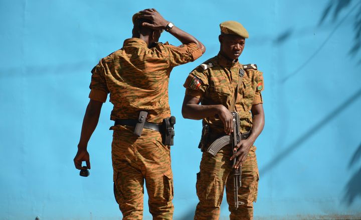 Burkina Faso troops patrol the army's headquarters in Ouagadougou on March 3, 2018.