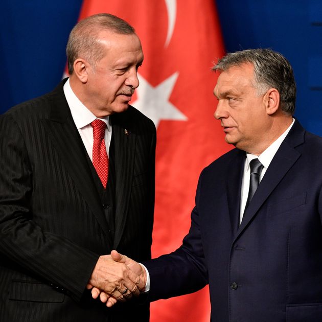 Turkish President Recep Tayyip Erdogan, left, and Hungarian Prime Minister Viktor Orban shake hands during a joint press conference after their meeting in Budapest, Hungary, Thursday, Nov. 7, 2019. (Zsolt Szigetvary/MTI via AP)