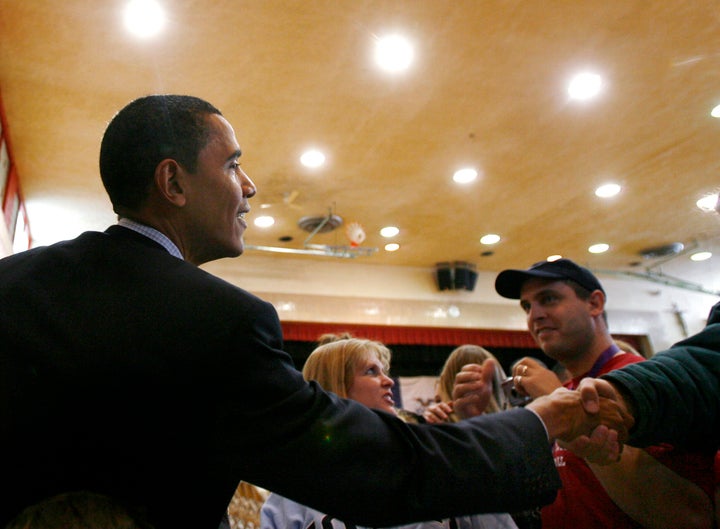 Obama as a presidential candidate, greeting voters during a campaign stop in Mason City, Iowa, in December 2007. Iowa Democra