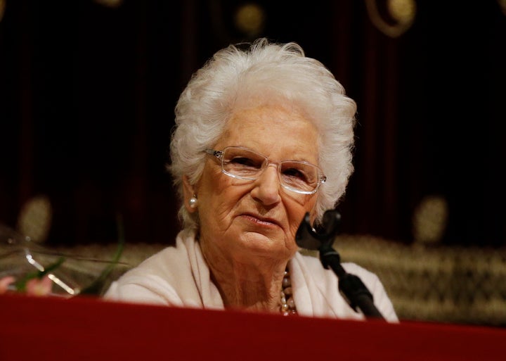 Holocaust survivor Liliana Segre speaks with young students on the occasion of a Holocaust remembrance, at the Arcimboldi theatre in Milan, Italy, Wednesday, Jan. 24, 2018.
