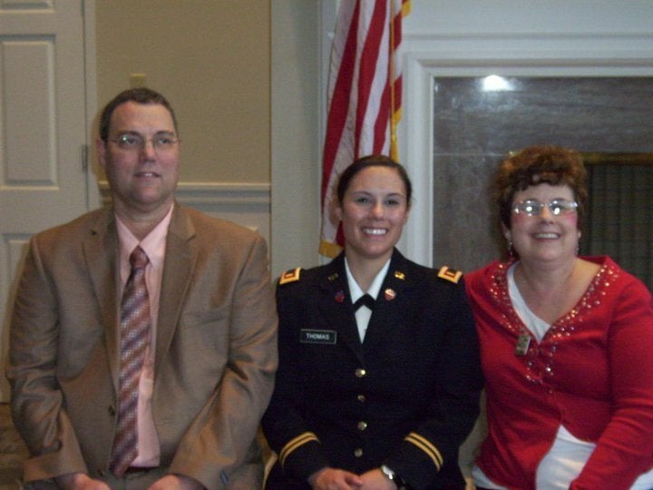 Thomas with her parents at Army National Guard commissioning, May 2011.