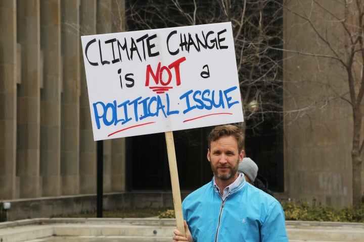 A protester at a rally to stop climate change outside a Toronto courthouse, April 15, 2019. The Ontario government was challenging the federal government's carbon tax.