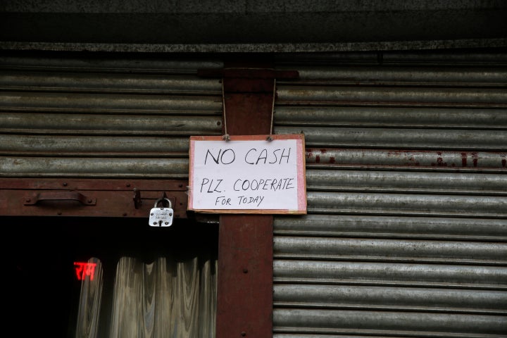A December 2016 photo of a notice outside a bank after it ran out of cash in Delhi. People were forced to stand in long queues to change banned notes and also to take out new currency from their accounts after severe limitations were imposed on withdrawal from banks and ATMs.