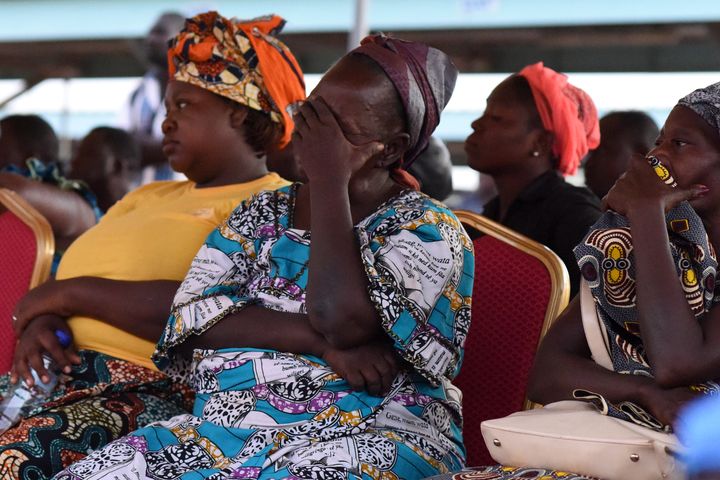 The family members of victims of a deadly ambush attack on workers near a Canadian-owned mine in Burkina Faso react during a meeting with officials in Ouagadougou on Nov. 7, 2019. 