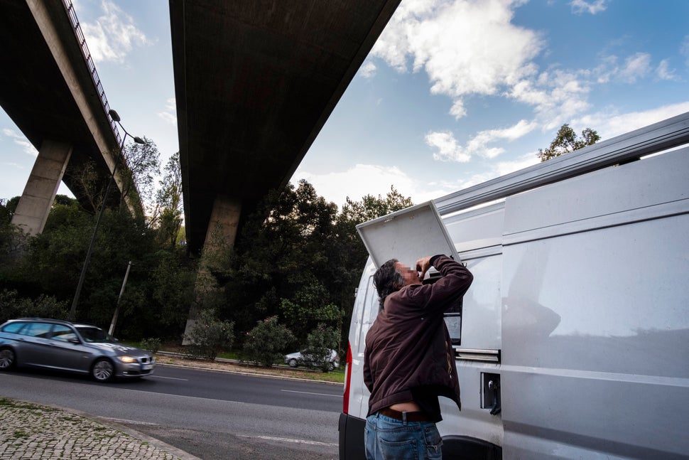 A man takes a dose of methadone from a van that provides it to combat drug addiction in Lisbon, Portugal on Nov. 4, 2019.&nbs
