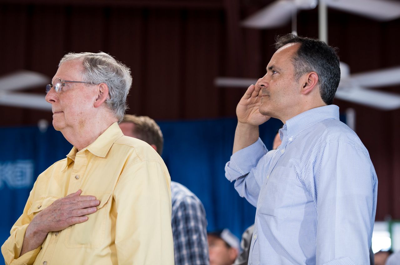 Senate Majority Leader Mitch McConnell (R-Ky.) and Kentucky Gov. Matt Bevin stand during the National Anthem at the annual Fancy Farm Picnic in Fancy Farm, Kentucky, on Aug. 6, 2016.