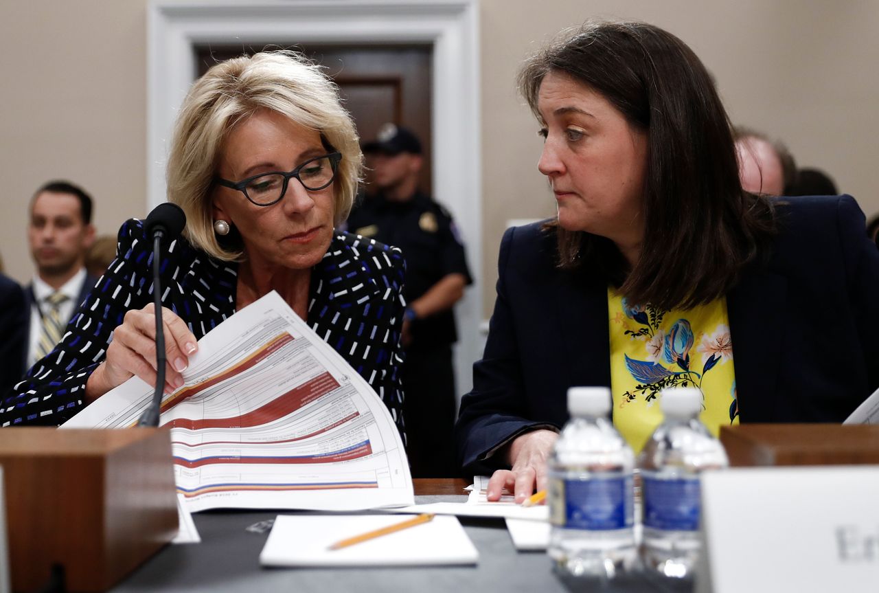 Education Secretary Betsy DeVos, left, accompanied by Education Department Budget Service Director Erica Navarro, testify at a hearing on the Education Department's fiscal 2018 budget on May 24, 2017.