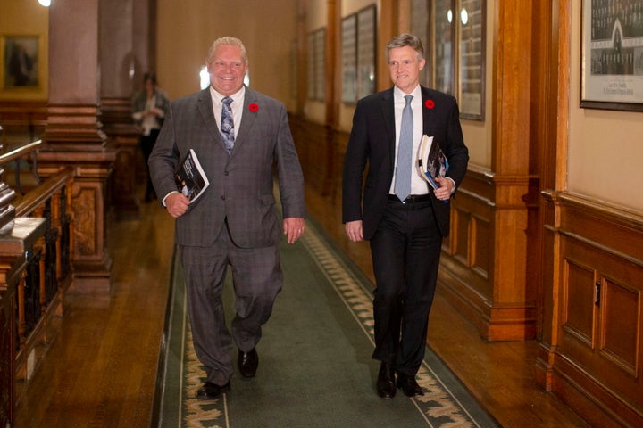Ontario Premier Doug Ford and Finance Minister Rod Phillips walk to the legislative chamber to deliver the fall economic statement in Toronto on Nov. 6, 2019.