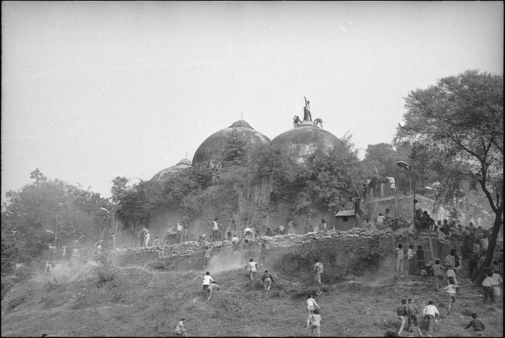 Karsevaks atop the Babri masjid shortly before it was demolished on December 6, 1992 in Ayodhya.