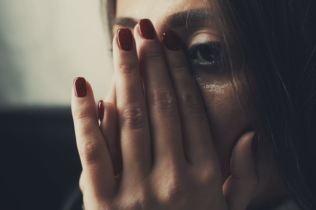 Depressed young woman crying