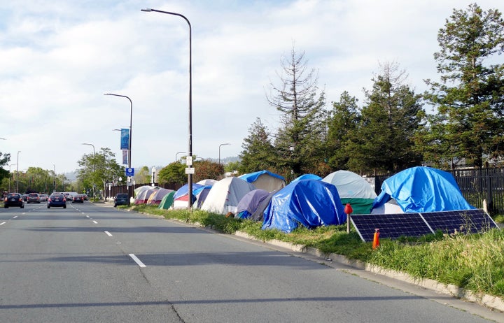Tent City on the edge of Adeline Street in Berkeley, California. The tech boom in the San Francisco area has provided the reg