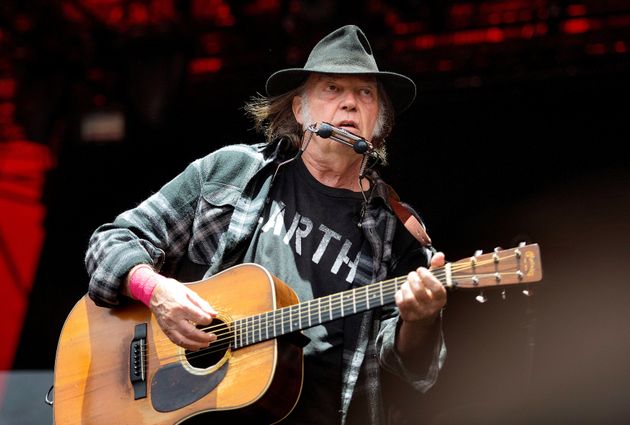 Neil Young performs at the Roskilde Festival in Denmark, on July 1,