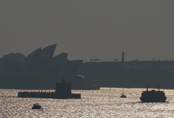 The Sydney Opera House is seen through smoke from bushfires in Sydney, Australia, November 11, 2019. 