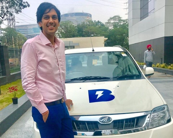 Blu Smart's founder Punit Goyal along with one of the electric cars on the platform.