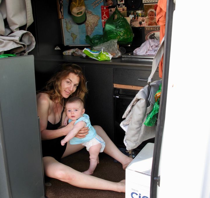 Trujillo with her daughter, Soleil, inside their van in Playa Hermosa, Peru, in 2013.