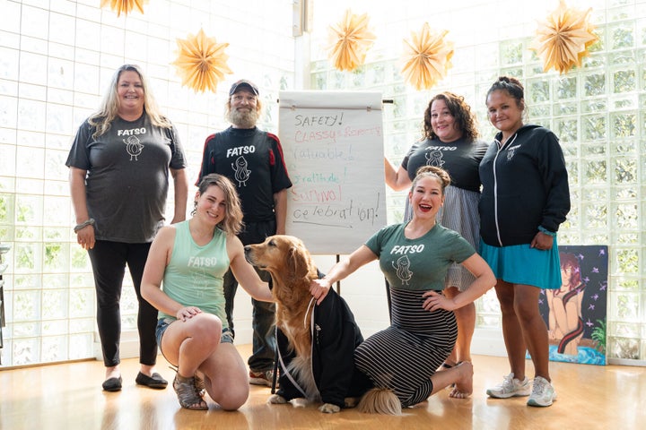 Members of charity group Peers, some of them former sex workers, pose in Fatso apparel.