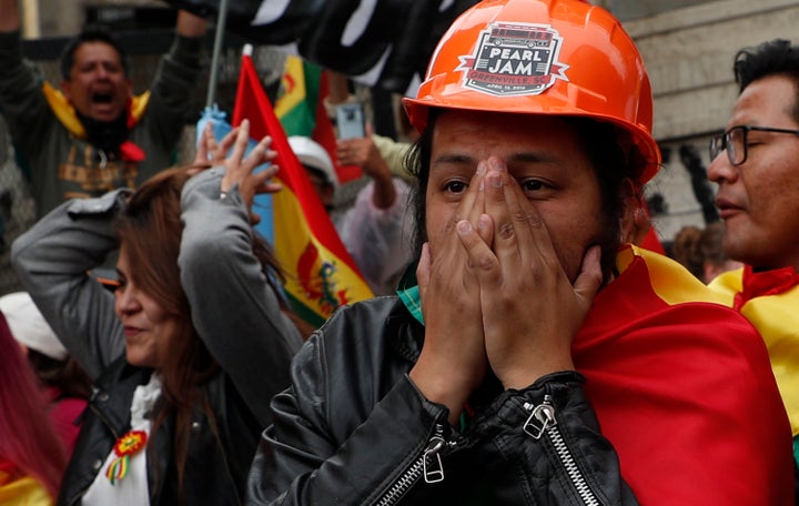 Opponents of Evo Morales react after his resignation announcement on Nov. 10, 2019.