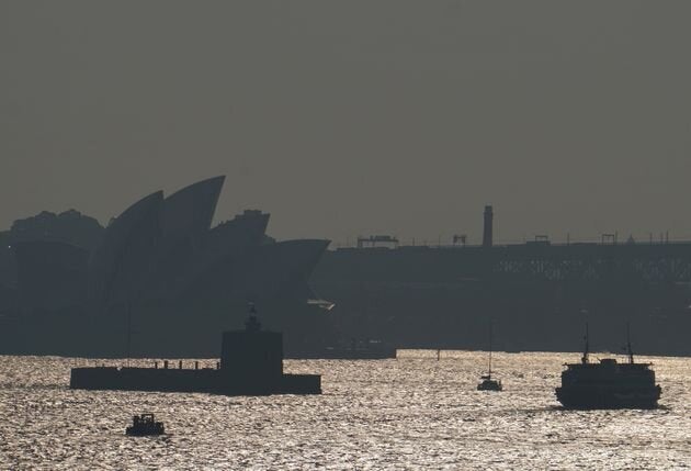 The Sydney Opera House is seen through smoke from bushfires in Sydney, Australia, November 11, 2019.