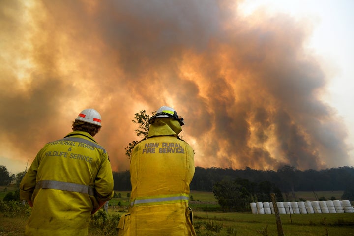 Smoke from a large bushfire is seen outside Nana Glen.