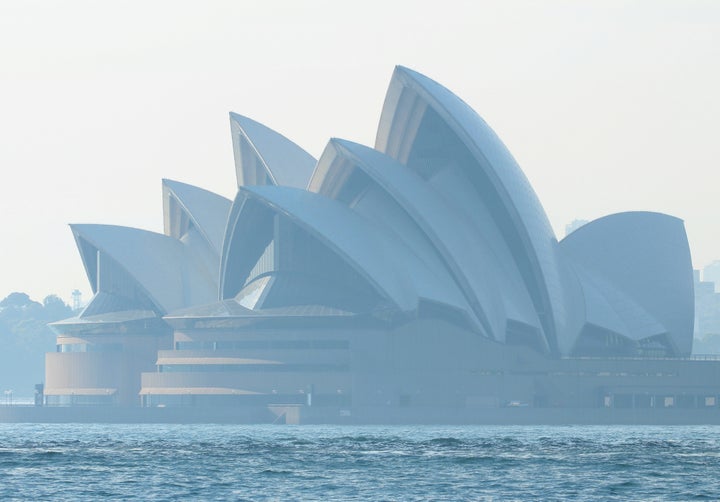 Smoke from bushfires shrouds the Sydney Opera House in Sydney.