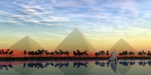 The Great Pyramids stand majestically over the Nile River running through the land of