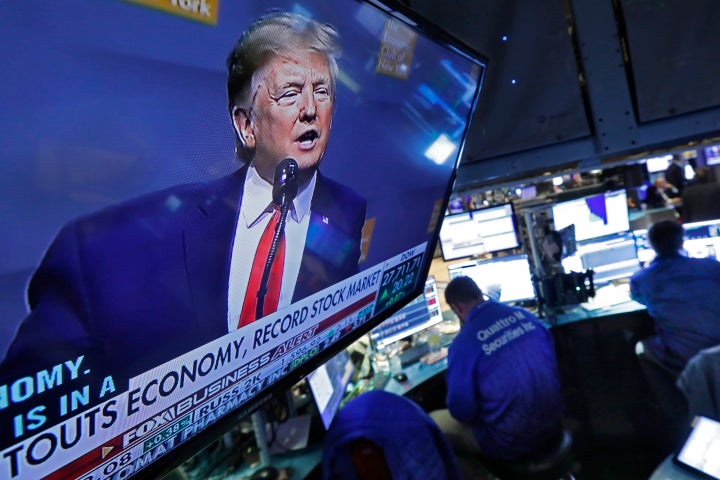 A television screen on the floor of the New York Stock Exchange