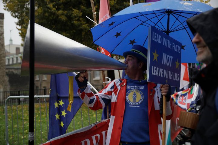 Steve Bray shouts as he protests opposite the Houses of Parliament in London.