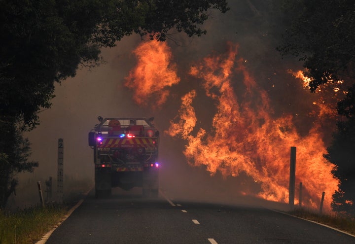 A fire truck is seen near a bushfire in Nana Glen.