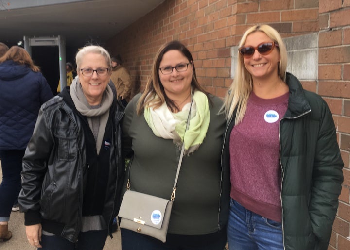 Janet Shoeman (left) and her daughters, Anna Shoeman and Jessica Borrer, attend a Bernie Sanders campaign rally in Des Moines