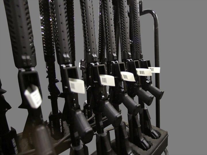 A rack of AR-15 rifles, graphic element on gray