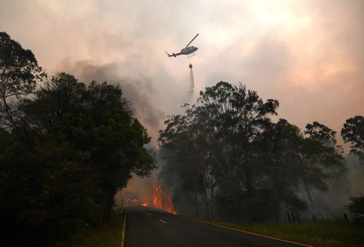 A water bomber drops its load on a bushfire in Nana Glen, near Coffs Harbour, Australia on Tuesday. 