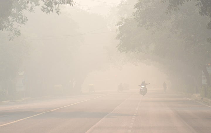 Smog and pollution on Bhagwan Dass road near Mandi House during the morning on November 12, 2019 in New Delhi.