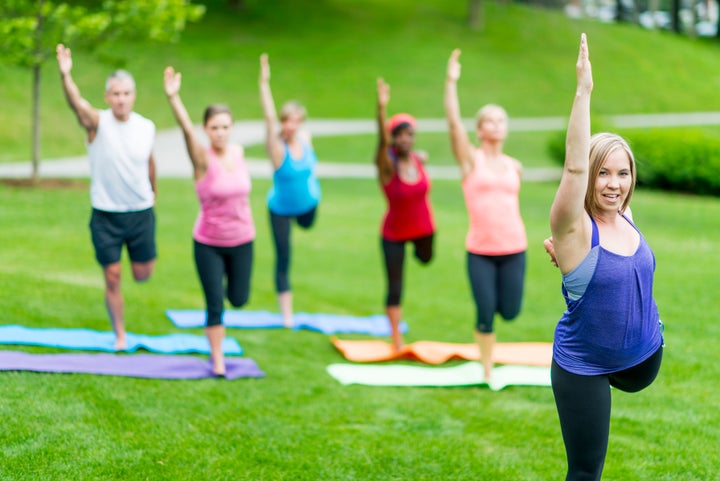 People doing yoga outdoors