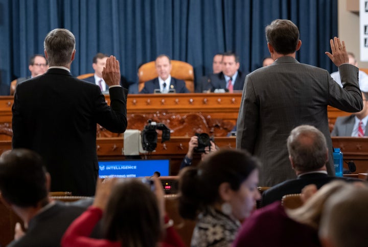 Ukrainian Ambassador Bill Taylor, left, and Deputy Assistant Secretary of State George Kent are sworn before testifying at the first public hearings held by the House Intelligence Committee as part of the impeachment inquiry into President Donald Trump.