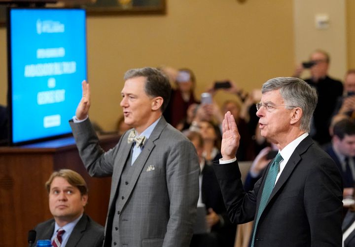 Deputy Assistant Secretary for European and Eurasian Affairs George P. Kent, left, and top U.S. diplomat in Ukraine William B. Taylor Jr. are sworn in before testifying in front of the U.S. House Intelligence Committee in Washington, D.C., on Wednesday.