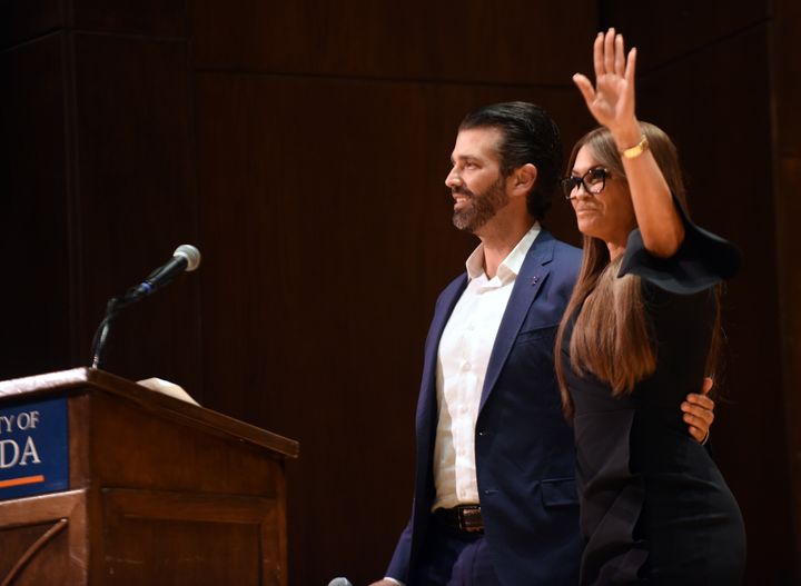 Donald Trump Jr. hugs his girlfriend, Kimberly Guilfoyle, before speaking at the University of Florida on Oct. 10.