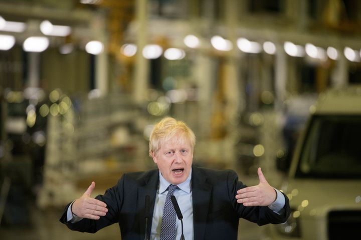 Prime Minister Boris Johnson addresses workers during a visit to the London Electric Vehicle Company in Coventry