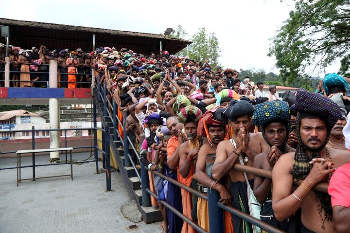 Devotees wait in queues inside the premises of the Sabarimala temple in Pathanamthitta district in Kerala, October 17, 2018.
