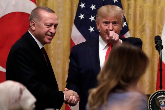 President Donald Trump shakes hands with Turkish President Recep Tayyip Erdogan after a news conference in the East Room of the White House, Wednesday, Nov. 13, 2019, in Washington. (AP Photo/ Evan Vucci)