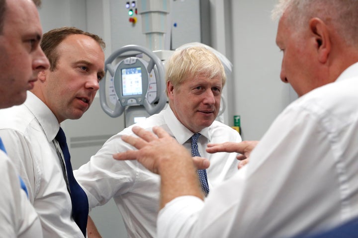 Prime Minister Boris Johnson (2nd right) and Matt Hancock, Secretary of State for Health and Social Care (2nd left)