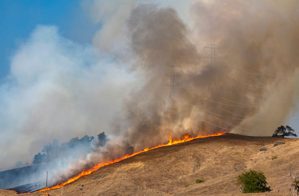 A back fire set by firefighters in an effort to control the fire in Geyserville, California, on Oct. 26.