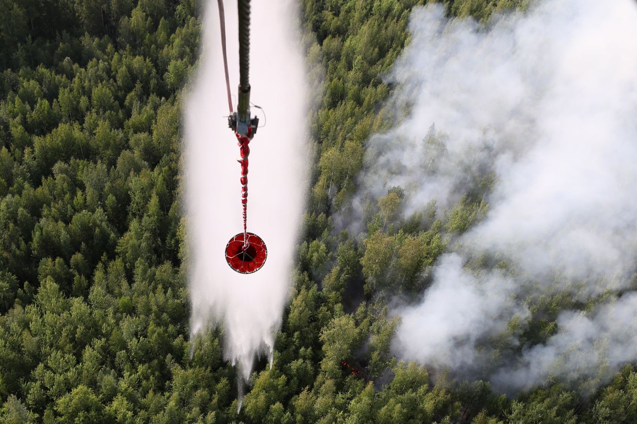 Battling a forest fire in Boguchany District, Russia, in August. More than a million hectares of woodland were hit by wildfires in Russia's Krasnoyarsk Territory.
