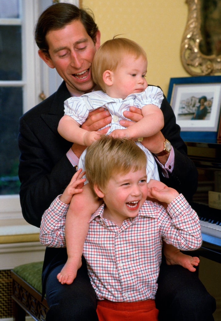 Prince Charles poses with his sons at Kensington Palace in 1985.