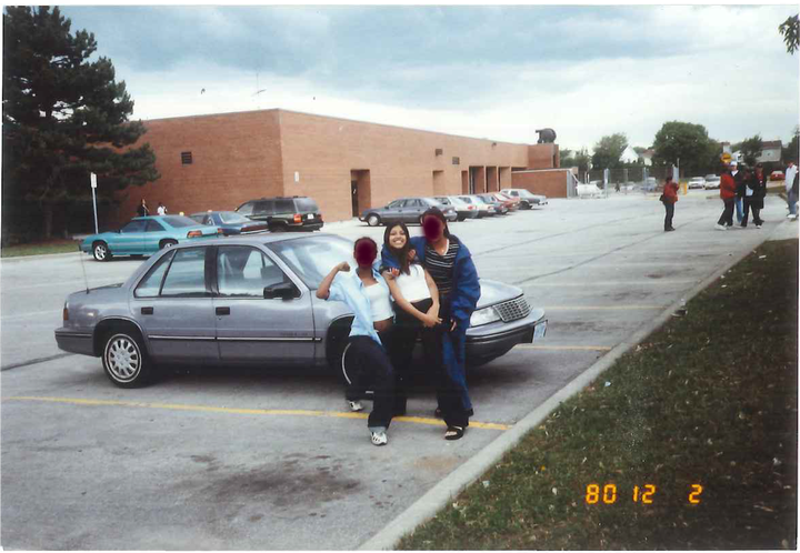 The writer, centre, and friends at school.